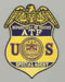 The Bureau of ATF badge (Dept. of Justice).